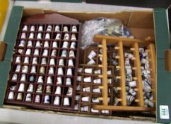 A large collection of display thimbles.