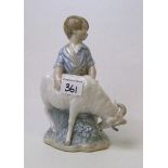 Lladro / Nao figure of a boy with a goat: