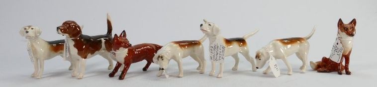 Beswick Foxhounds 2263: 2264, 2265 and 2262 together with a small seated fox 1748, Beagle 1939 and a