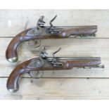 Pair of early copies of Flintlock Duelling Type Pistols: brass barrels, Ketland on locks