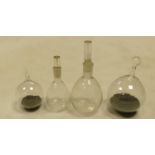 A collection of laboratory glass bottles to include : lead weighted glass density bulbs & two