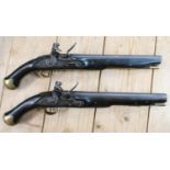 20th Century Pair of Britishl long Sea service Pistols: belt hooks on reverse, ordinance stamps on