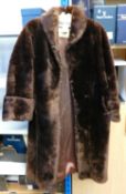 Fur coat size 12 14: Knee length brown.