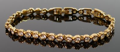Swarovski gold plated tennis bracelet: set with diamond style stones.
