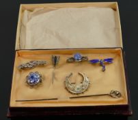 A collection of Antique Silver brooches: and hat pin. (7)