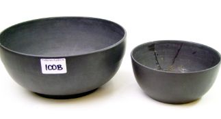 Two old Wedgwood black basalt bowls: diameter of largest 23cm ( both A/F)
