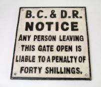 A reproduction cast metal Belfast & County Down railway sign: