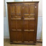 Early 20th Century oak linen fold two door wardrobe: Height 189cm x 127cm wide x 55cm deep