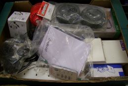 A collection of electrical items: floodlight, fusebox, extension gang, cables etc.