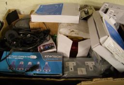 A mixed collection of electrical items: down lights, adapters, sockets etc.