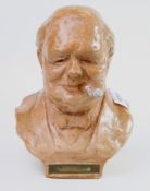A large vintage terracotta table lighter: fashioned as a bust of Winston Churchill by Tallent (