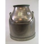 A large vintage metal milk churn: