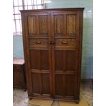Early 20th Century oak linen fold two door wardrobe: Height 168cm x 104cm wide x 48cm deep