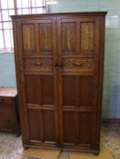 Early 20th Century oak linen fold two door wardrobe: Height 168cm x 104cm wide x 48cm deep
