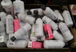 A mixed collection of hair and beauty products: shampoo, hair dye, talc etc.
