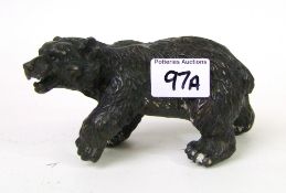 A cast bronze figure of a bear: