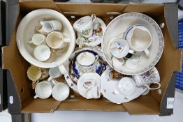 A mixed collection of items to include: hand painted floral cup & saucer, commemorative cups,
