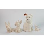 A collection of Beswick dogs: including seated pippy 308 and three various comical dog with ladybird