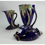 A collection of Beswick dark blue Palm Jugs: and wallplaque. (3)