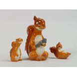 Beswick comical squirrel family: comprising Squirrel with nutcracker 1009, seated 1007and lying