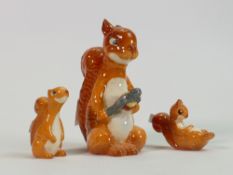 Beswick comical squirrel family: comprising Squirrel with nutcracker 1009, seated 1007and lying