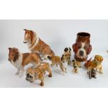 A collection of various pottery and resin dog models: including dogs head tankard etc (10)