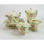 A collection of Beswick Flowerkist tea ware: as purchased by Queen Mary, comprising teapot, stand,