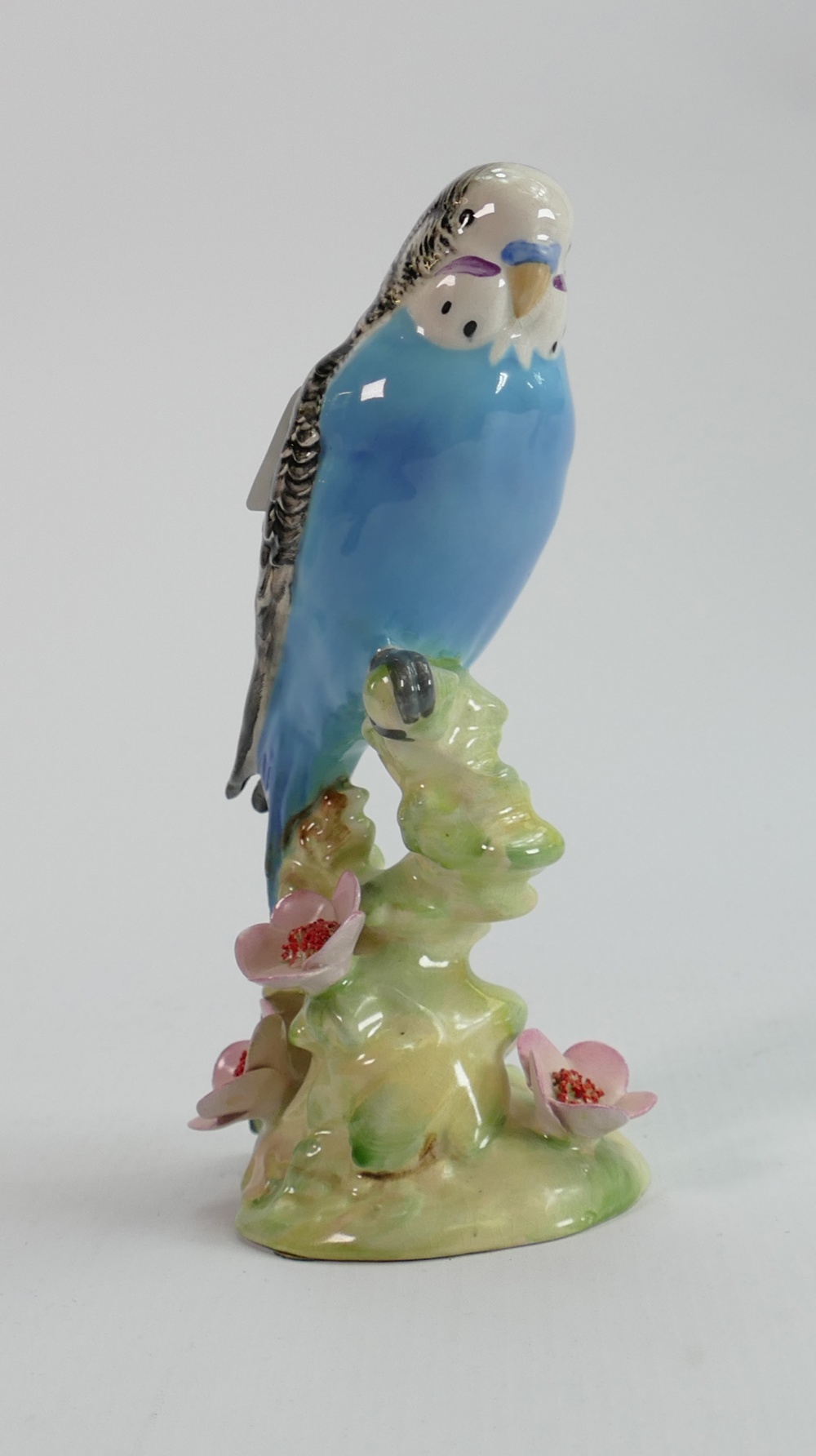 Beswick blue budgie on floral base 1217: (chip to petal edge)