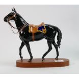 Beswick Mountie Stallion, model number 2431: mounted on wood base, 25cm high.