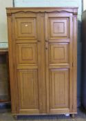 Two door honey oak gentleman's wardrobe: 179cm high x 106cm wide x 55cm deep
