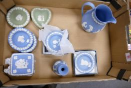 A collection of Wedgwood Jasper ware to include: water jug, pin trays, lidded box, vase etc