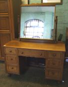 Honey oak knee hole dressing table: with vanity mirror. 122cm wide x 154cm high ( with mirror) x
