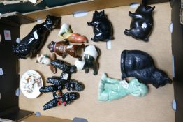 A mixed collection of items to include: Ceramic dogs, cats & pigs, novelty decanters etc