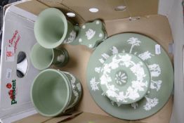 A collection of Wedgwood Sage Green items to include: planter, vases, lidded boxes etc