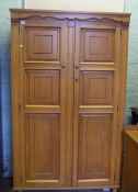 Two door honey oak wardrobe: 179cm high x 106cm wide x 55cm deep