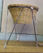 A wrought iron and wicker log basket/flower basket: