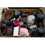 A collection of vintage camera lenses: Bell & Howell 62mm, Sigma 52mm, Helios 44mm, Vivita MC Tele