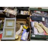 A mixed collection of items: picture frames, lamps, clocks, door stops etc (3 trays).