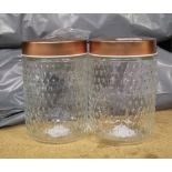 A quantity of glass storage jars with copper effect lids: (approx 28).