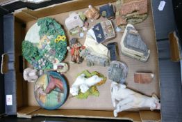 A mixed collection of items to include: John Hine & similar novelty miniature houses, resin rigures,