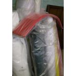 A quantity of rolls of fabric/material (approx 9 rolls).