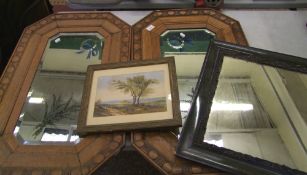 A pair of oak framed vintage wall mirrors: octagonal in form, 83cm x 53cm, plus an Art Nouveau metal