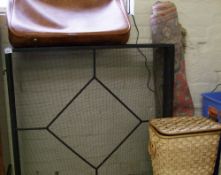 A mixed collection of items: wrought iron industrial fire screen, wicker basket, vintage suitcases