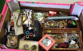 A large collection of costume jewellery: brooches, necklaces, compacts, jewellery boxes etc (1
