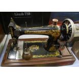 A cased Singer sewing machine: Model V336842, with original Singer oil can.