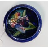 Moorcroft trinket dish in the Orchid pattern: 11cm diameter. Impressed and signed in blue. Potters