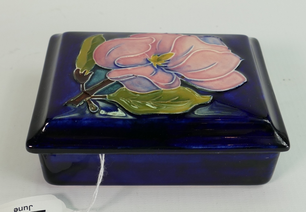 Moorcroft box with lid in Anemone pattern: Measures 12.5cm wide. Impressed mark with label.
