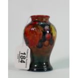 Moorcroft vase in the Wisteria pattern: 10cm high, impressed mark. Large restored chip to base.