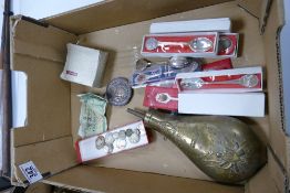 A mixed collection of items to include: repro powder flak, collectable spoons, silver coins, The