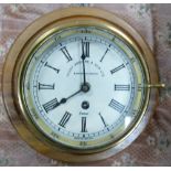 Brass cased Ships Bulkhead Clock by Henry Browne & Sons: mounted, diameter of dial 14.5cm